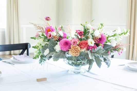 A floral table centerpiece in a Holly Chapple Abelia compote bowl