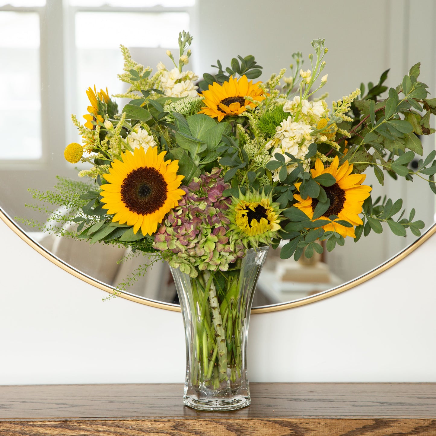 46 & Spruce flared glass vase 10 3/8 inch, featuring a beautiful sunflower bouquet, perfect for elegant home decor.