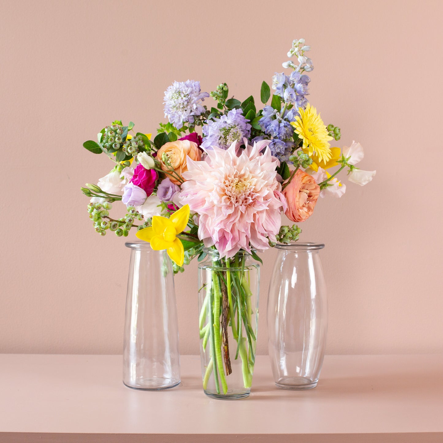 46 & Spruce 9-inch trio glass bouquet vase assortment, featuring a beautiful floral arrangement in three clear vases, perfect for elegant home decor.