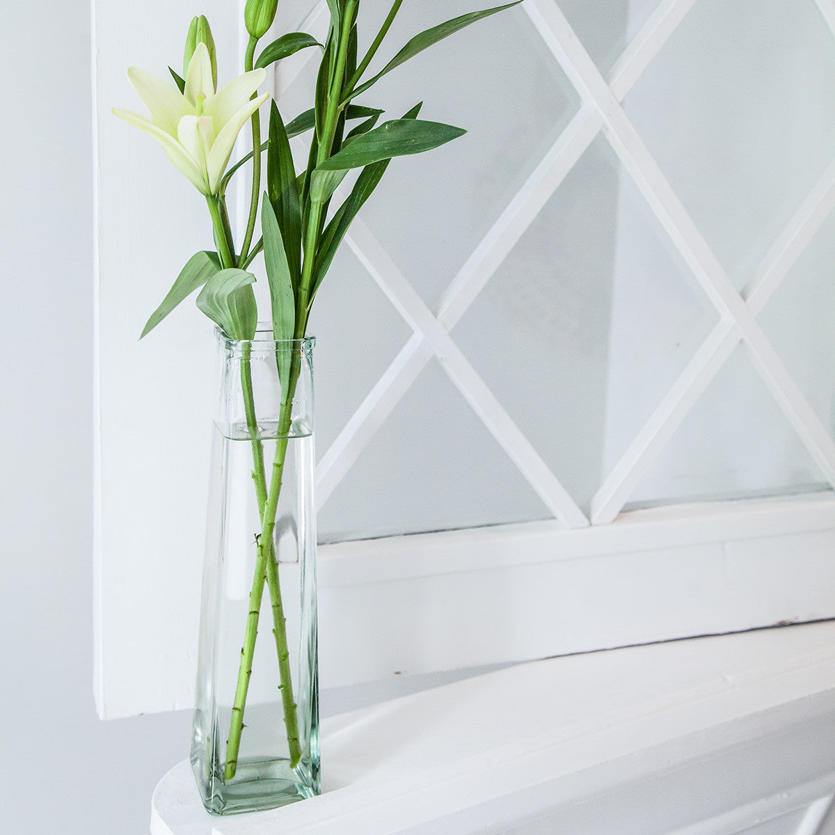 slender pyramid vase with white lillies