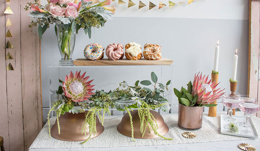rose gold centerpieces on tablescape