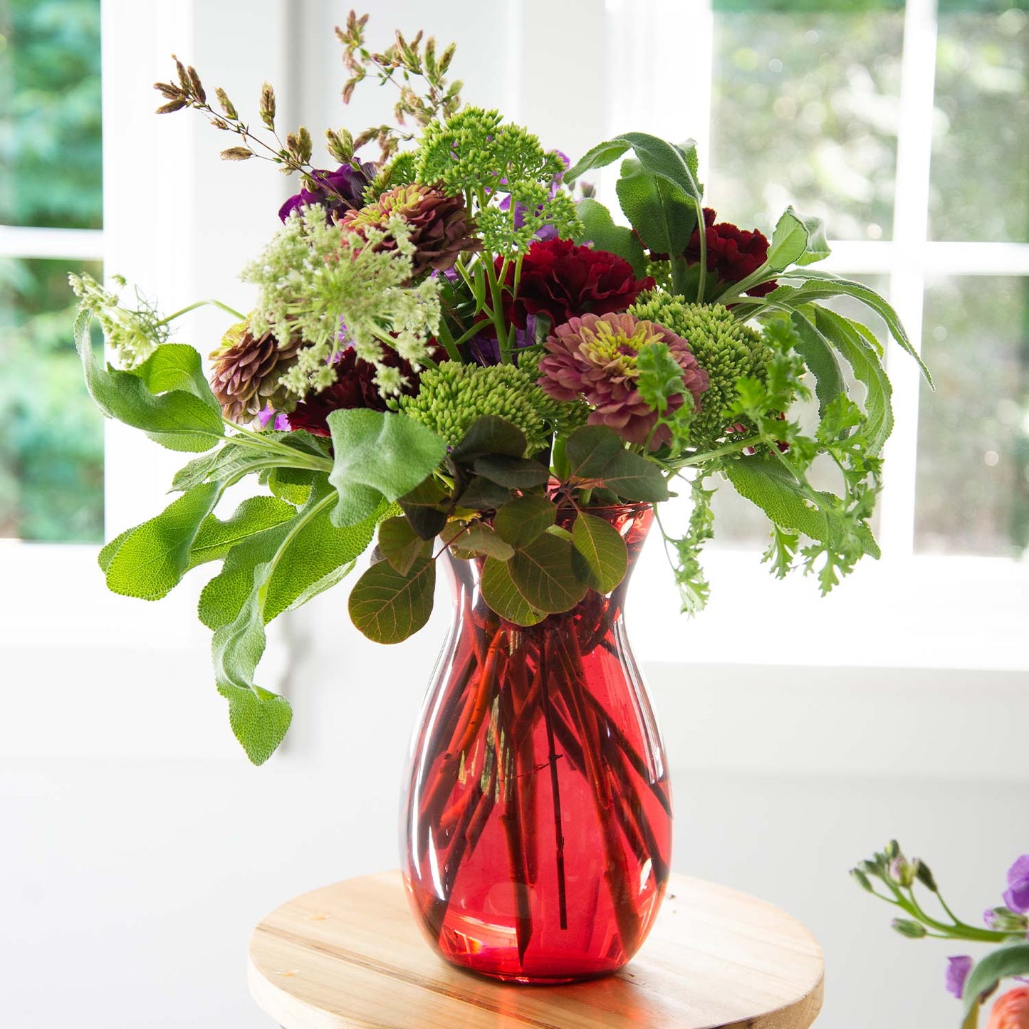 Assortment of flowers held in place by a Jordan Vase - 46 &Spruce