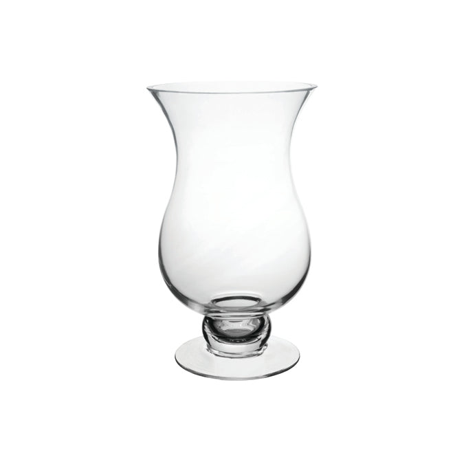 An empty Charlotte Vase featuring an hourglass shape with a sturdy, footed base, crafted from transparent glass against a white background, showcasing its elegant design suitable for centerpieces.