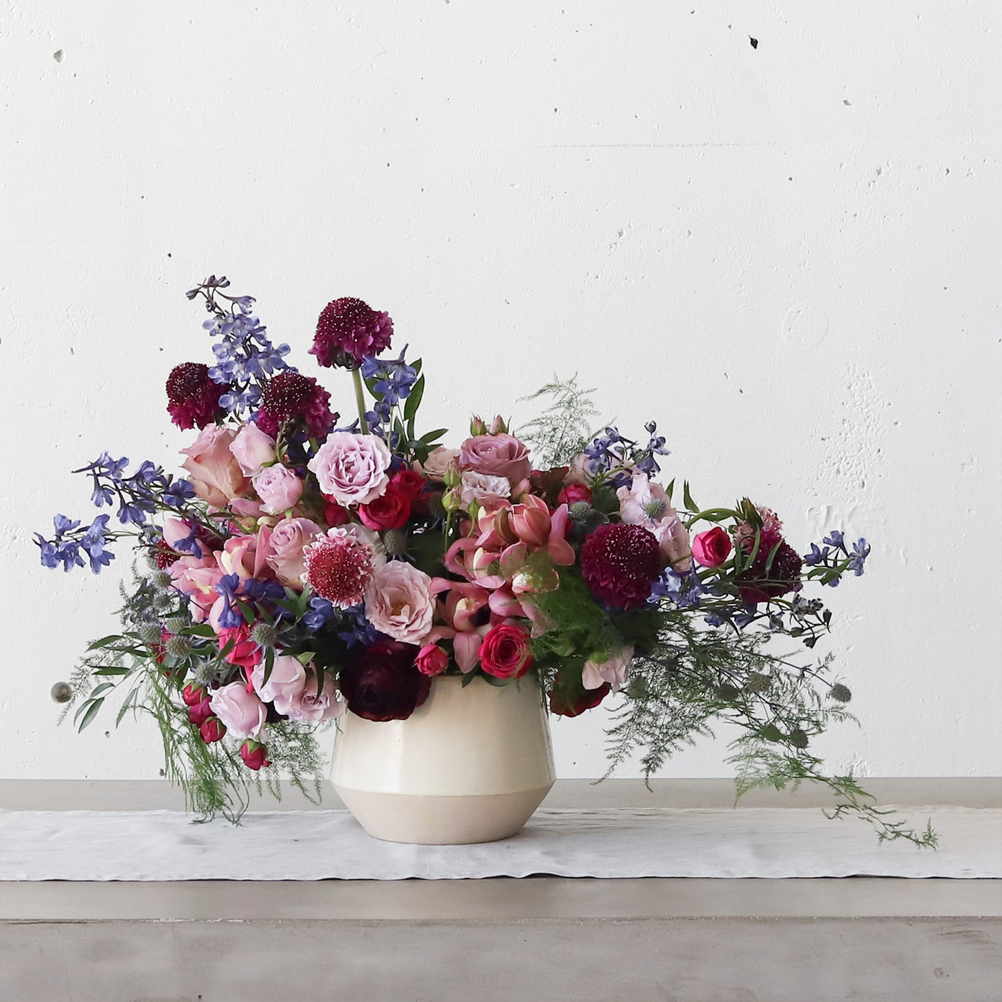 Beautiful flowers in our crock with a tapered bottom.