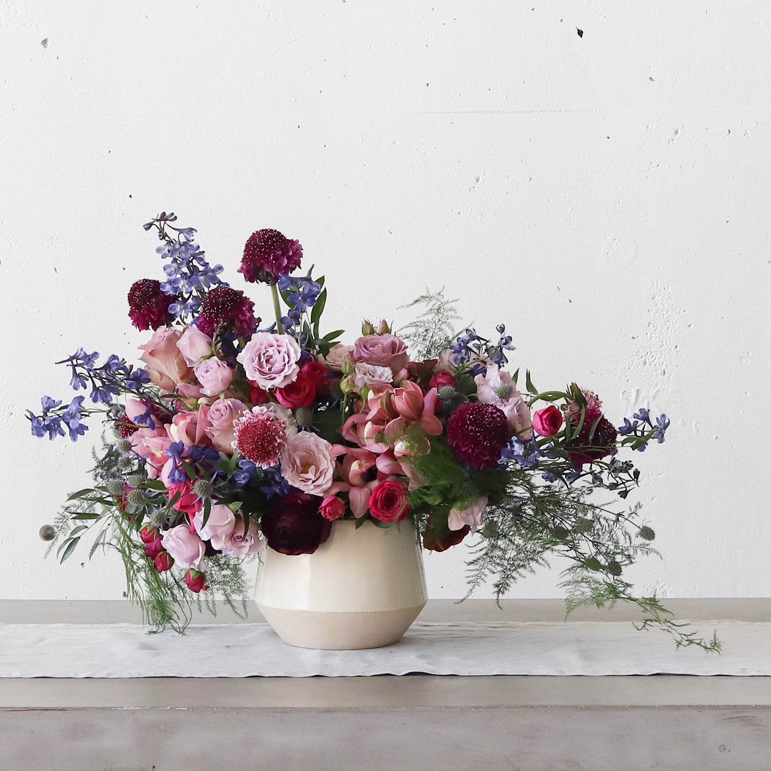 Beautiful flowers in our crock with a tapered bottom.