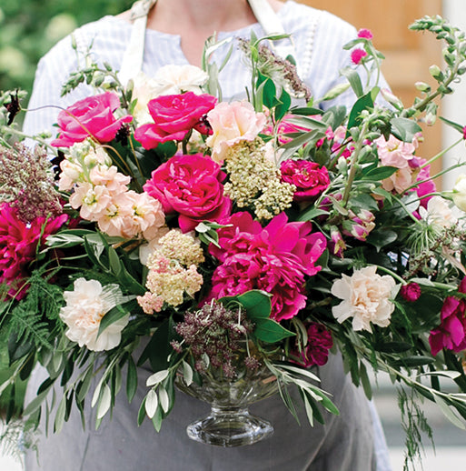 Holly Chapple Pillow in a bouquet